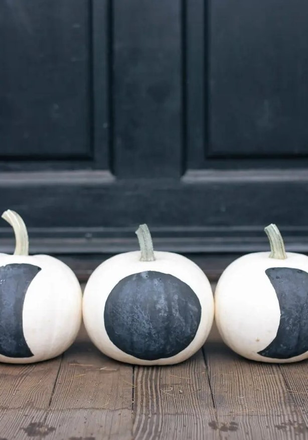 simple DIY black and white moon phase pumpkins are amazing for modern Halloween or fall decor, and they will be great for constellation decor