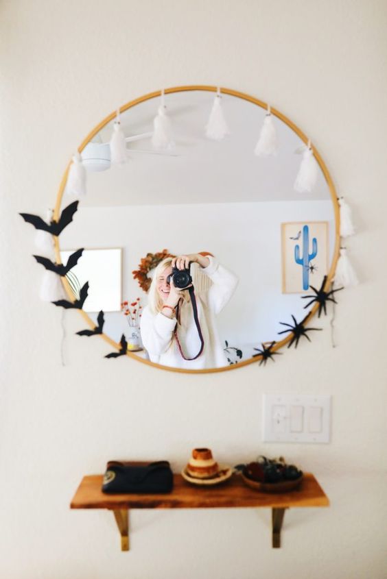 simple and cool Halloween mirror decor with white ghost tassels, black bats and spiders is a cool and fast to make idea