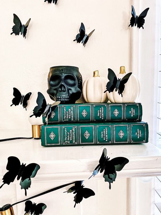 a black butterfly garland and matching butterflies on the wall will give a refined and chic touch to the space