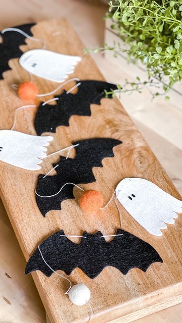 a cool woolen Halloween garland with ghosts, bats and pompoms is a cute decoration for Halloween