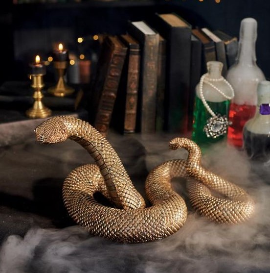 a gold resin snake with a textured metallic gold finish is a lovely idea for Halloween decor and it looks refined