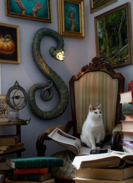 a large serpent wall decoration with a light inside is a spooky and catchy Halloween decoration to rock