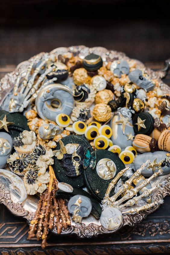 a beautiful and creative wedding dessert assortment with a celestial feel, with stars, moons and other stuff