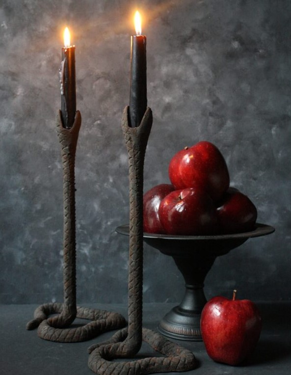 scary textural snake candleholders with black candles are perfect for styling your home for this holiday