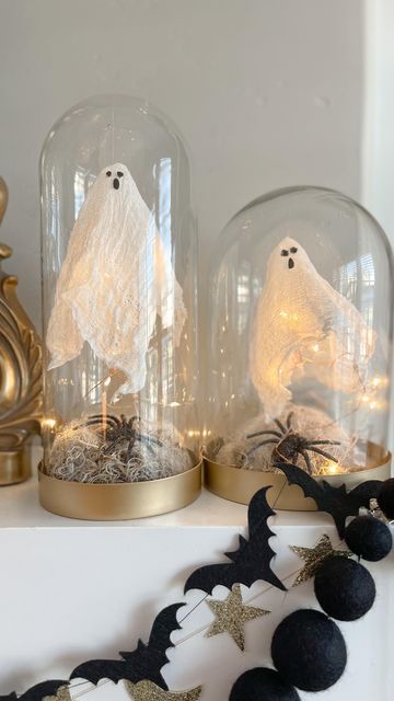 black bat, gold star and black pompom garlands are a cool way to style a Hallwoeen mantel