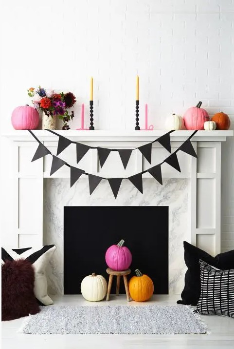 pink, orange and white pumpkins, pink and mustard candles, bright floral arrangements for Halloween