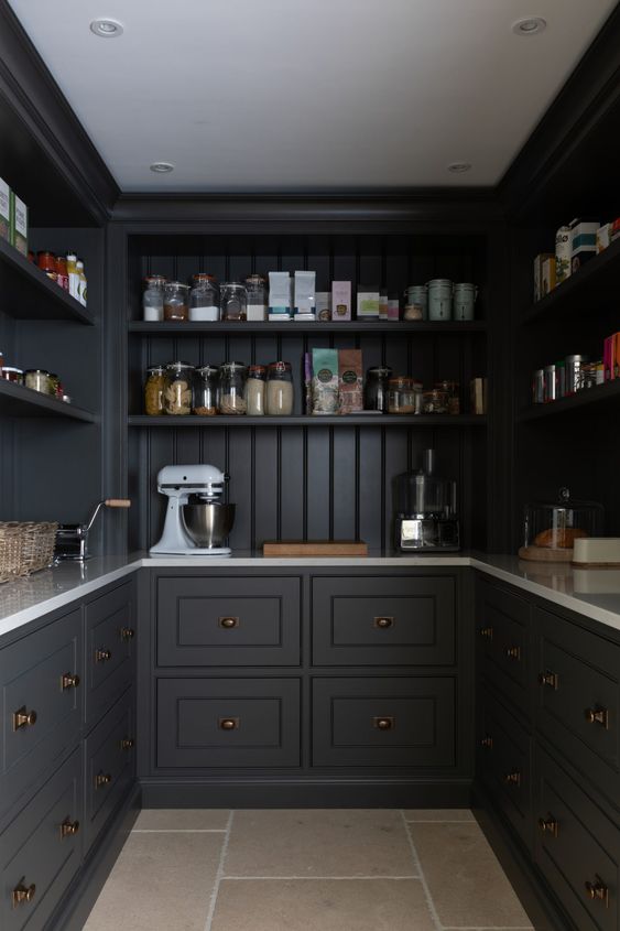 a soot pantry with open shelves and shaker style cabinets, built-in lights and everything necessary for a kitchen