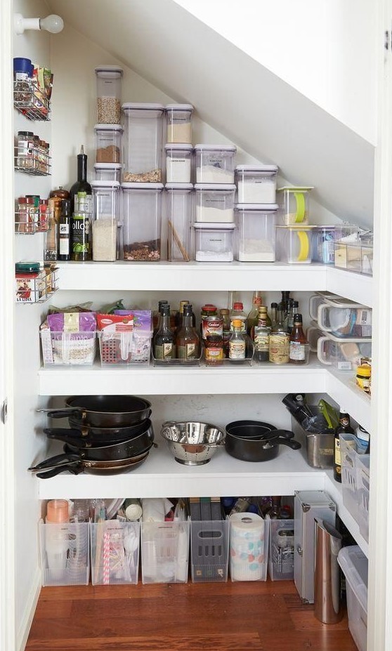 https://www.digsdigs.com/photos/2023/09/a-staircase-pantry-with-built-in-open-shelving-cubbies-and-smaller-metal-shelves-on-the-wall-is-a-cool-and-smart-idea.jpg
