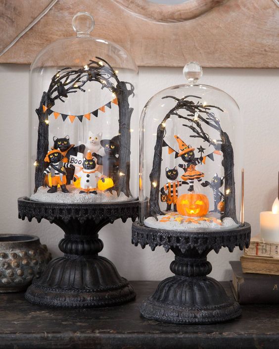 black vintage cloches with black cats dressed up, an orange pumpkin, black trees and black and orange banners