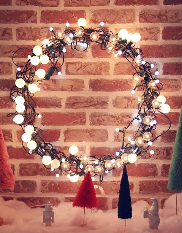 a light string Christmas wreath is a great idea to make your front door even more welcoming