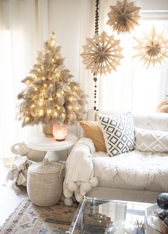 a tabletop pampas grass Christmas tree with lights is a cool and chic idea for a boho space, it looks natural and pretty