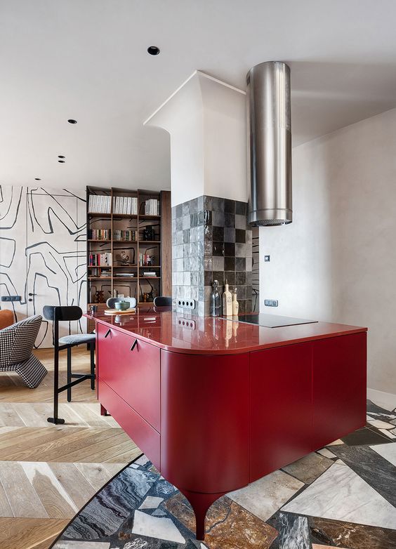 a creative small red kitchen wrapped around a pillar is a unique way to integrate your kitchen into a living room