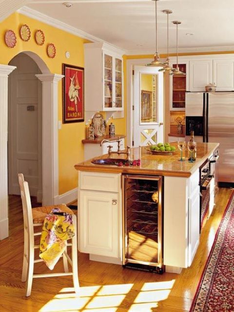 kitchen island with a drink cooler and an oven