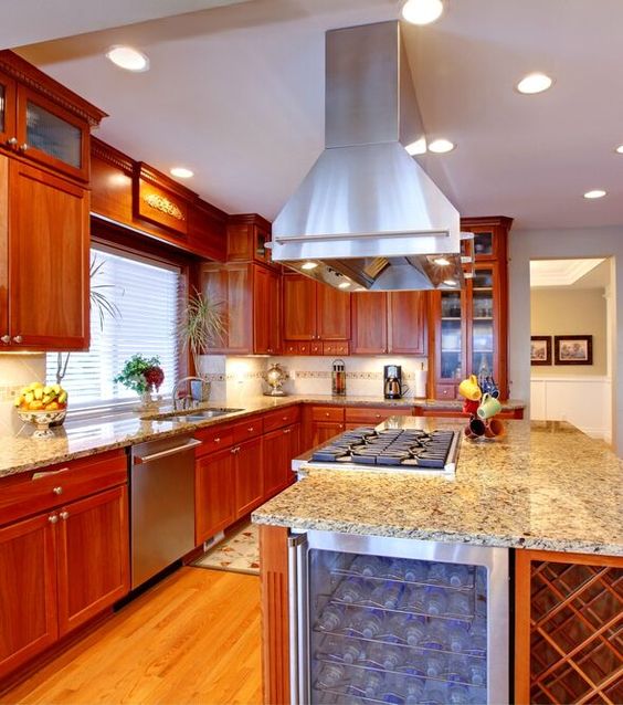 kitchen island with a drink cooler and cook top