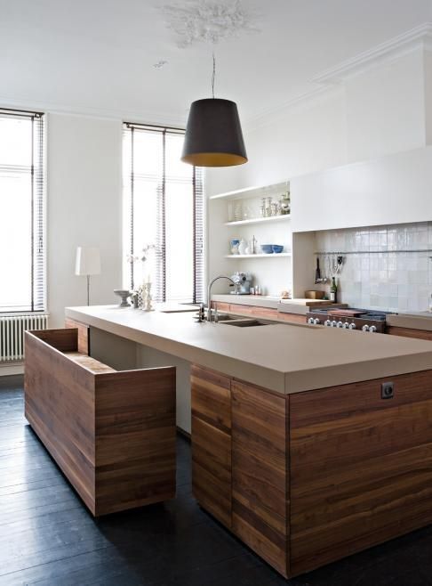 kitchen island with a table and a bench