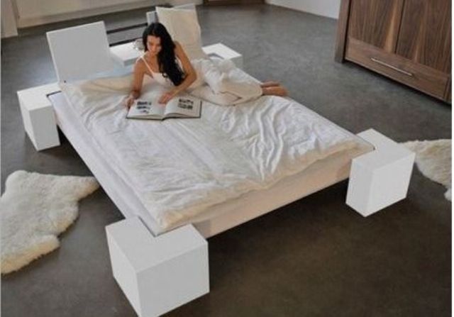 wooden platform bed on tall legs