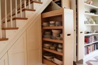 29 dishes and tableware storage under the stairs