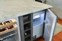 29 kitchen island with a fridge and a cooler