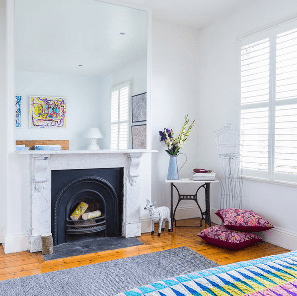 oversized mirror over the fireplace