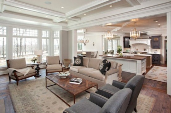 Spacious traditional style open space with floor to ceiling winnows in earthy single color scheme.