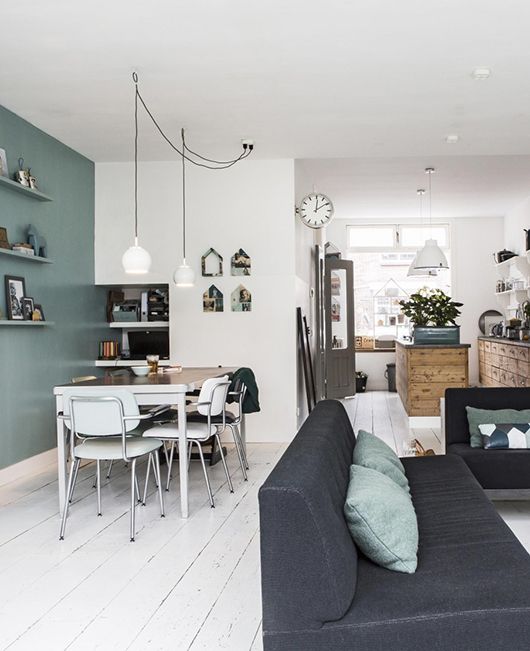 Cute living room combined with a vintage dining area and a rustic kitchen.