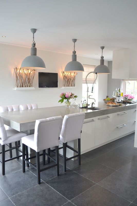 long kitchen island with an eating counter