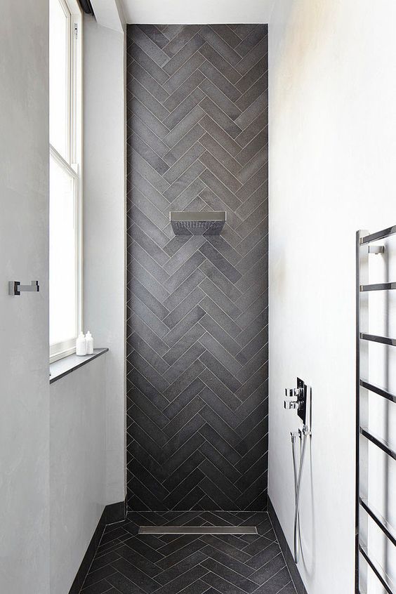 dark herringbone shower tiles