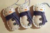 neutral and navy snowman Christmas ornaments with scarves, embroidery and buttons are lovely and bold for holidays