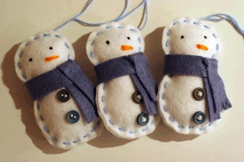 neutral and navy snowman Christmas ornaments with scarves, embroidery and buttons are lovely and bold for holidays