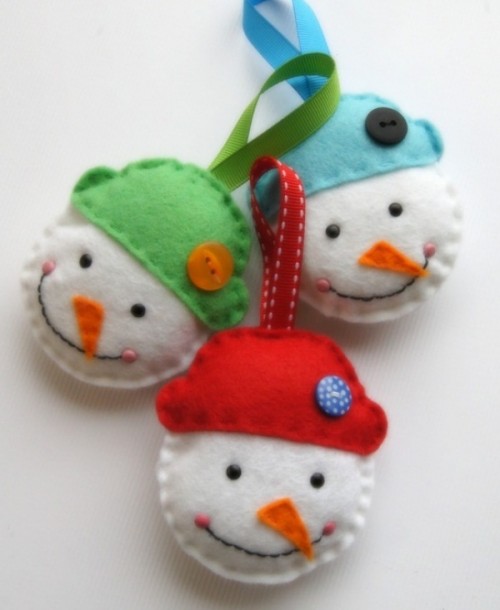 snowmen heads in colorful hats, with buttons and loops are fun and bold decorations you can easily DIY