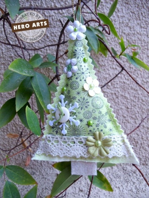 a chic pastel green and white Christmas tree ornament with buttons, beads and fabric flowers is a nice and pretty idea