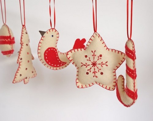 red and white embroidered Christmas ornaments shaped as stars, candy canes and birds are lovely and cool