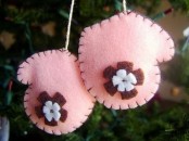 pink felt mitten ornaments with felt flowers are lovely and cute Christmas decorations you can make yourself