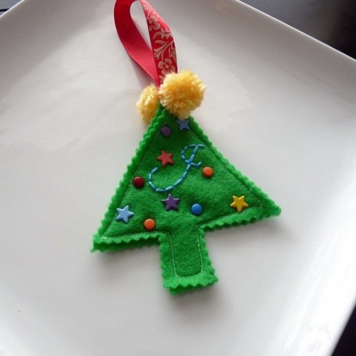 a bright green felt Christmas tree ornament with colorful beads and stars plus pompoms is a bold and fun idea