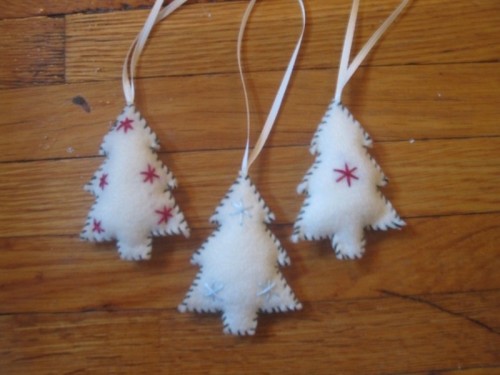 white Christmas tree ornaments with red and blue embroidery are lovely and very bold and can be rocked any time