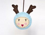 a funny and colorful deer head Christmas ornament with antlers and a cute face is always a cool idea