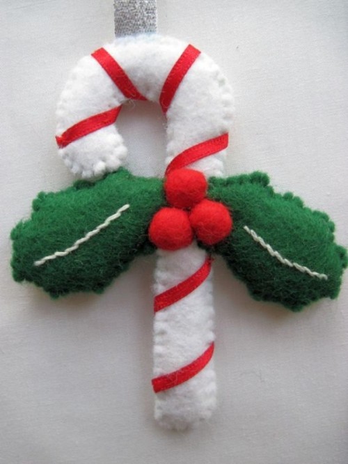 a bright striped candy cane Christmas ornament of felt, with leaves and beads will add a fun and whimsical touch