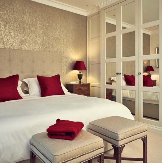 an extended headboard plus mirror doors of the wardrobe make the bedroom look bigger and more welcoming