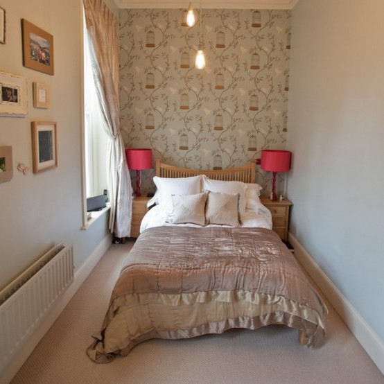 neutrals make the small bedroom larger and a large window floods it with natural light