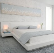 a small bedroom fully done in white and light pastels feels and looks larger and more inviting