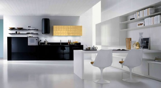 a white kitchen with black cabinets, black appliances, a white dining zone with a folding table and a couple of chairs is a fresh and sleek space