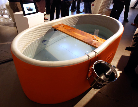 Blofield Inflatable Bathtub With a Champagne Bucket And a Wood Rack