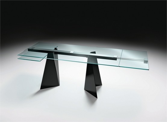 a modern dining table with a blue glass tabletop and black triangle legs and a construction that holds the tabletop is a catchy and architectural idea