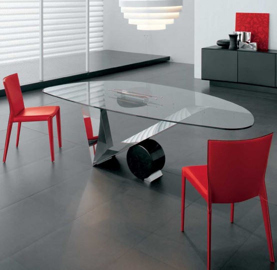 a stylish modern glass dining table with an oval glass tabletop, a metal triangle base with a ball will make a statement in a modern dining room