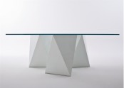 a modern dining table with a geometric and architectural concrete base and a glass tabletop is a chic and cool idea for a modern dining room