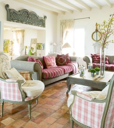 a bright Provence living room with refined furniture, a coffee table, neutral curtains, bright pillows and upholstery