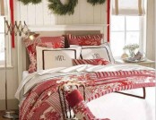 a red and white bedding set, evergreen wreaths over the bed will make your bedroom feel likeChristmas