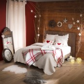 plaid bedding, Christmas trees with heart and star ornaments hanging for a cute winter-like look