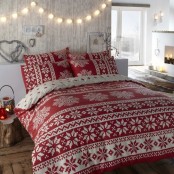 string lights, red lanterns and red and white printed Christmas bedding for a holiday-like space