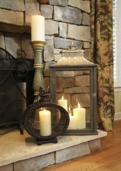 place some candle lanterns, maybe different ones, in your fireplace or next to it for a beautiful touch